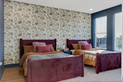 a bathroom with a double vanity sink and mirror