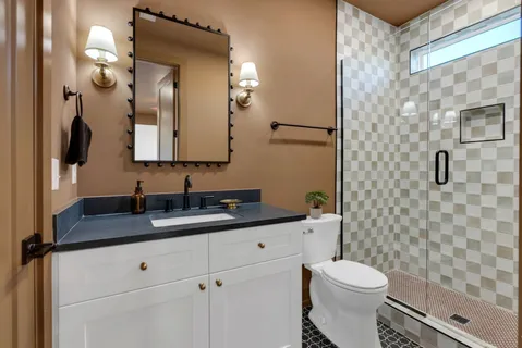 a room with pool table and stairs