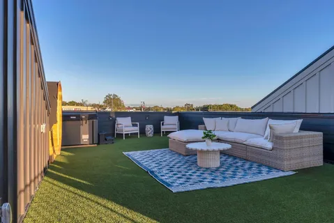a view of a backyard with a tub