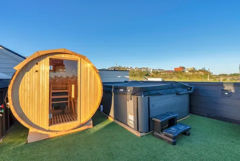 a view of a hallway with wooden floor and entryway