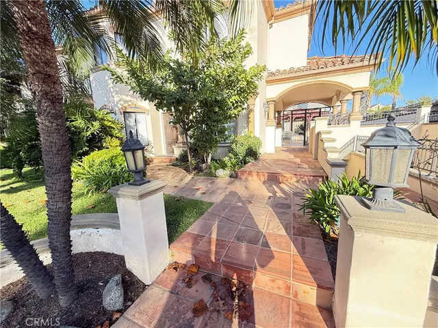 a view of backyard of house with outdoor seating