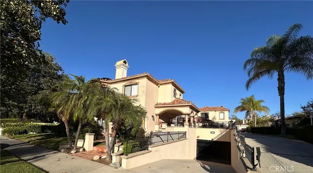 a view of a yard with plants and a bench