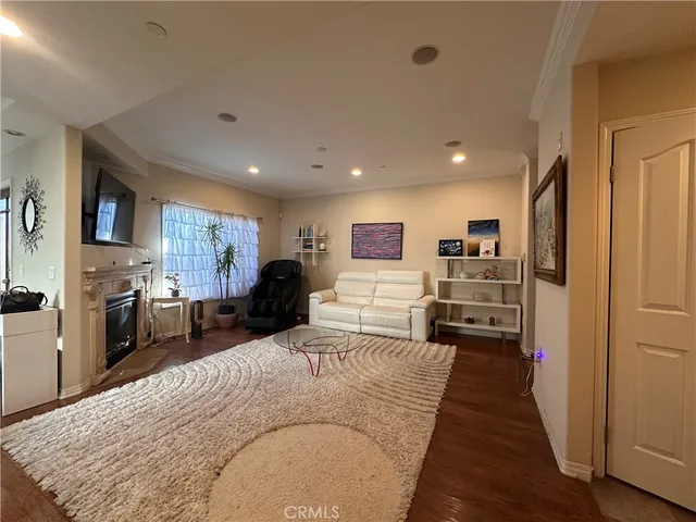 a large bedroom with a bed and furniture