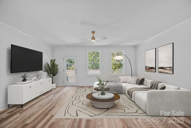 a living room with furniture and a flat screen tv
