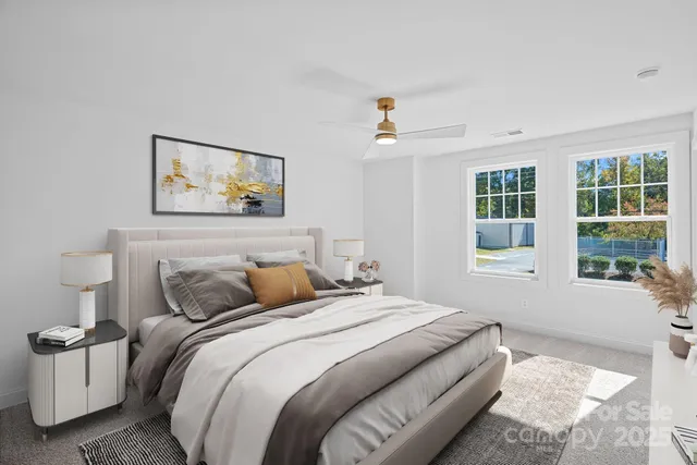 a bedroom with bed and a window