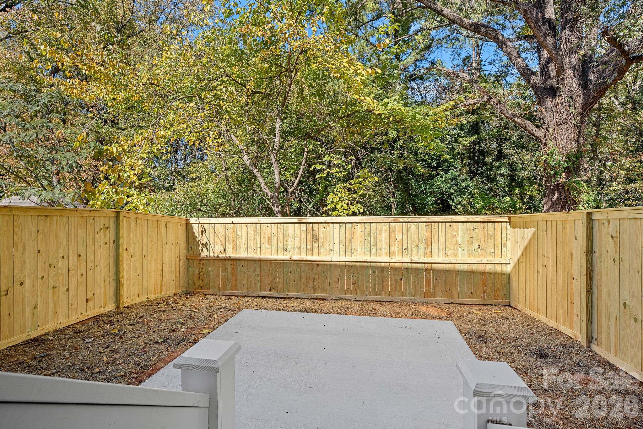 4017 Sofley Road Charlotte, NC 28206 - Photo 9 of 23 a view of wooden fence and trees