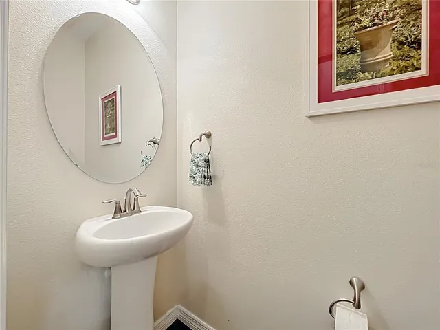 a bedroom with a bed dresser and a window