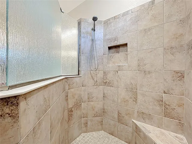 a view of green field with tree in the background