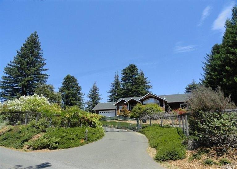 3907 Joy Road Occidental, CA 95465 - Photo 1 of 1 Front of home as seen from Joy Road. This wonderful home, at the top of the ridge, is bathed in sun, and yet, surrounded by redwoods, is remarkably private. Automatic entry gate makes for easy access!
