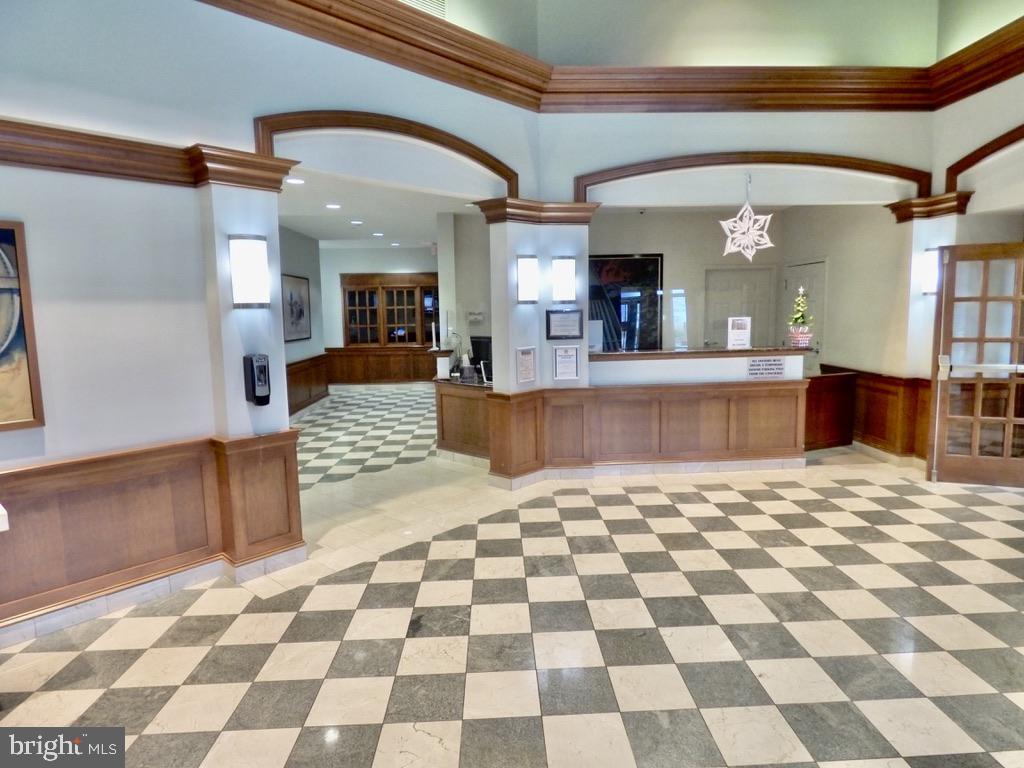 11800 Sunset Hills Road, Unit 118 Reston, VA 20190 - Photo 2 of 52 Elegant lobby with checkerboard floor.