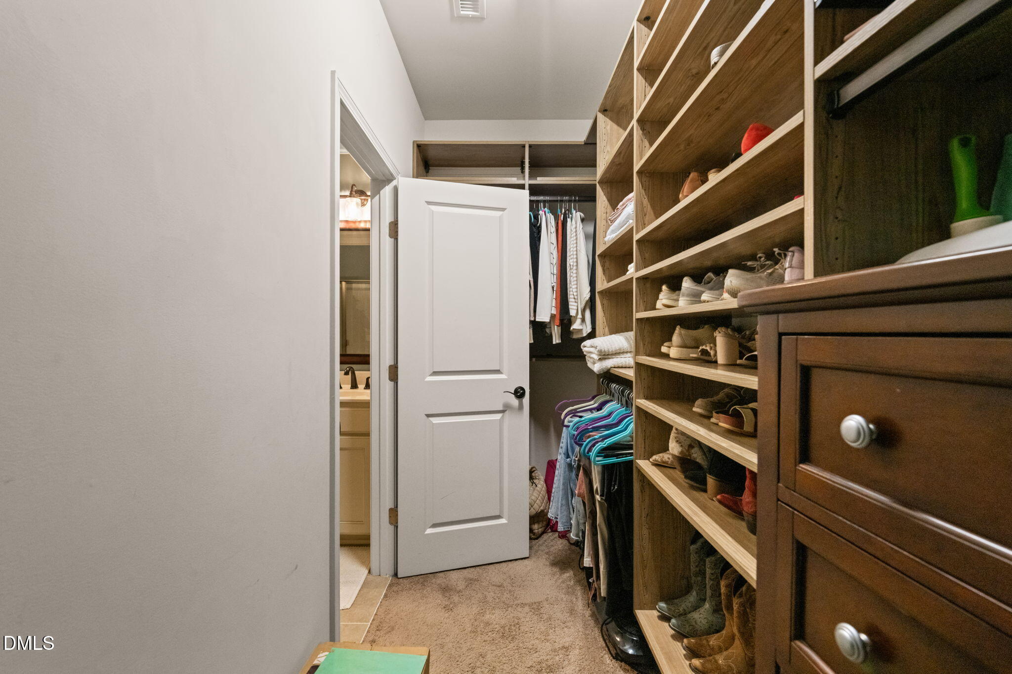 1716 Main Divide Drive Wake Forest, NC 27587 - Photo 22 of 45 a view of walk in closet with clothes and shoes