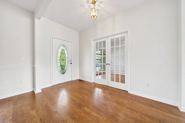 a view of a livingroom with a ceiling fan and window