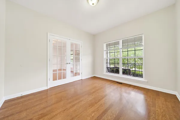 a spacious bathroom with a double vanity sink a mirror and a