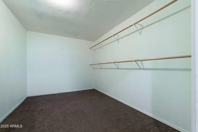 a view of a room with racks on the wall