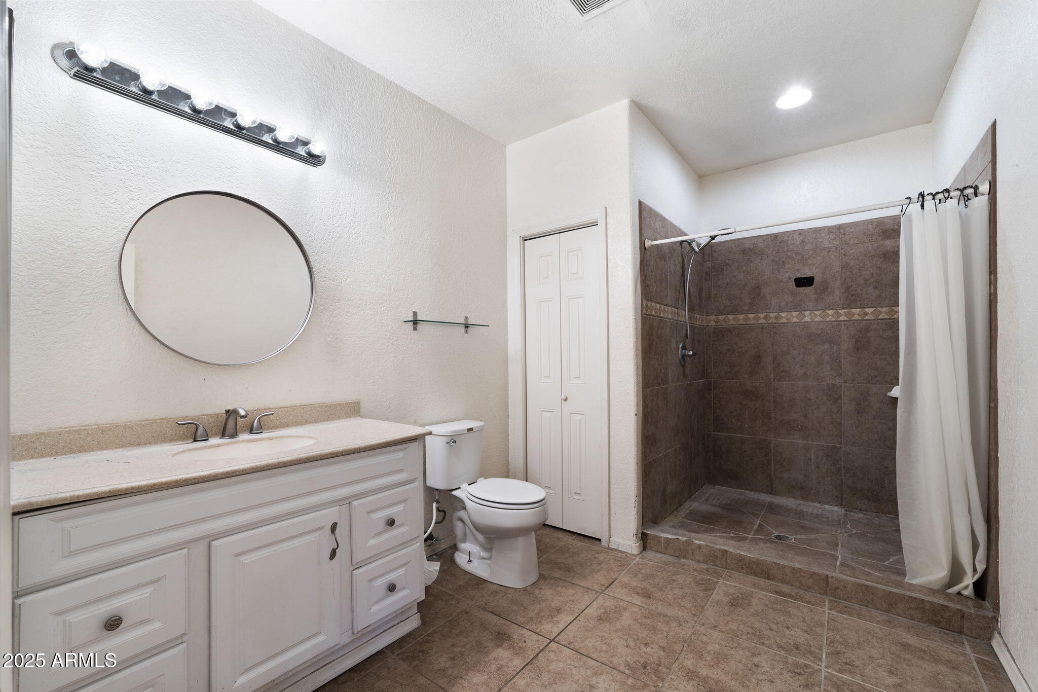 117 North Arroya Road Apache Junction, AZ 85119 - Photo 24 of 27 a bathroom with a double vanity sink toilet mirror and shower