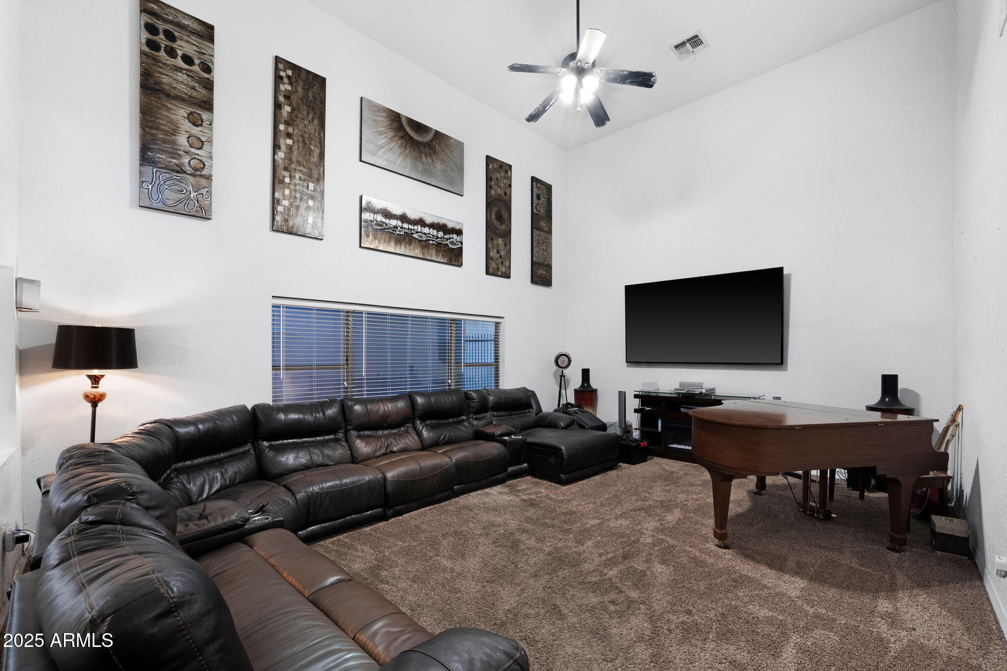 117 North Arroya Road Apache Junction, AZ 85119 - Photo 8 of 27 a living room with furniture and a flat screen tv