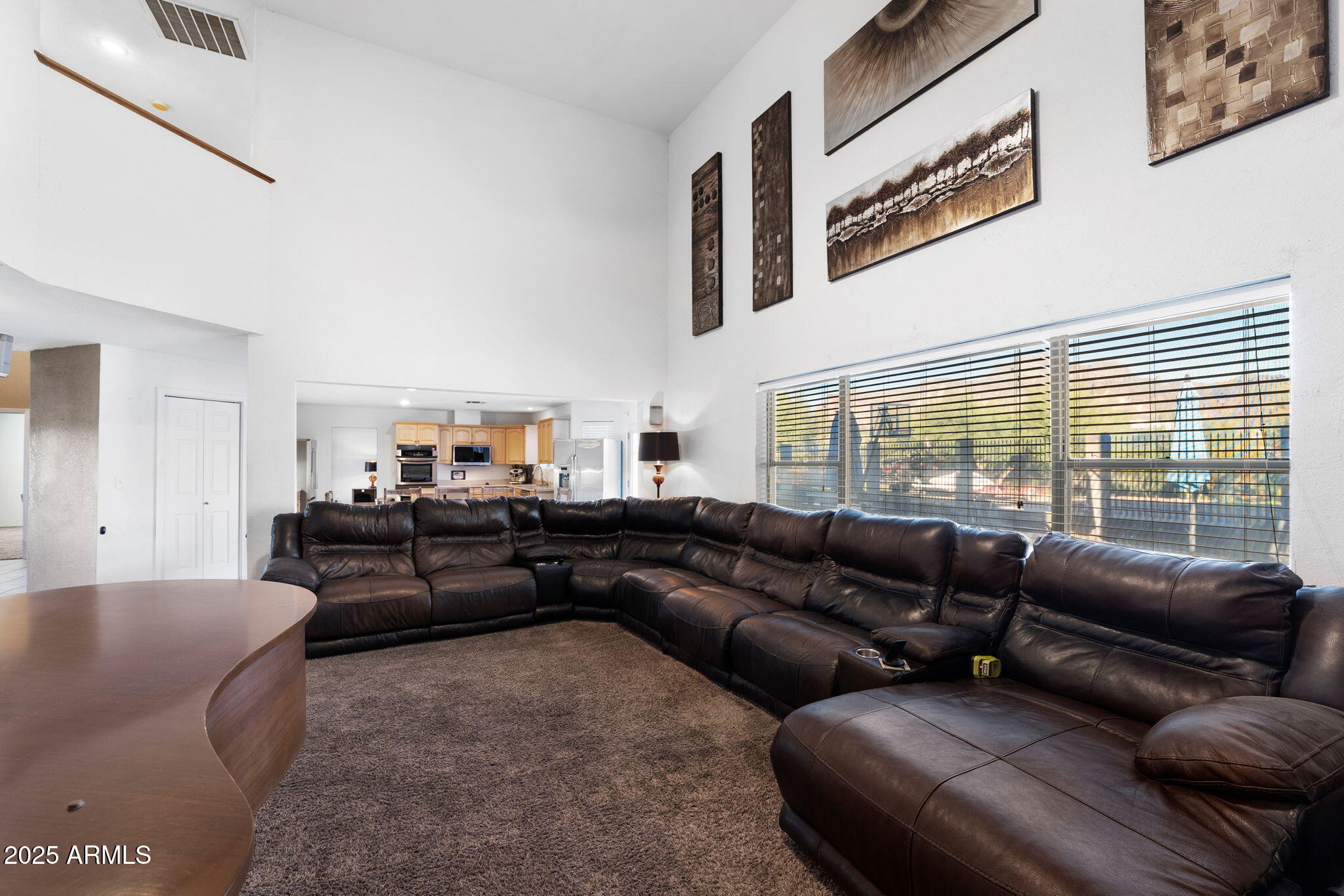 117 North Arroya Road Apache Junction, AZ 85119 - Photo 9 of 27 a living room with furniture and a large window