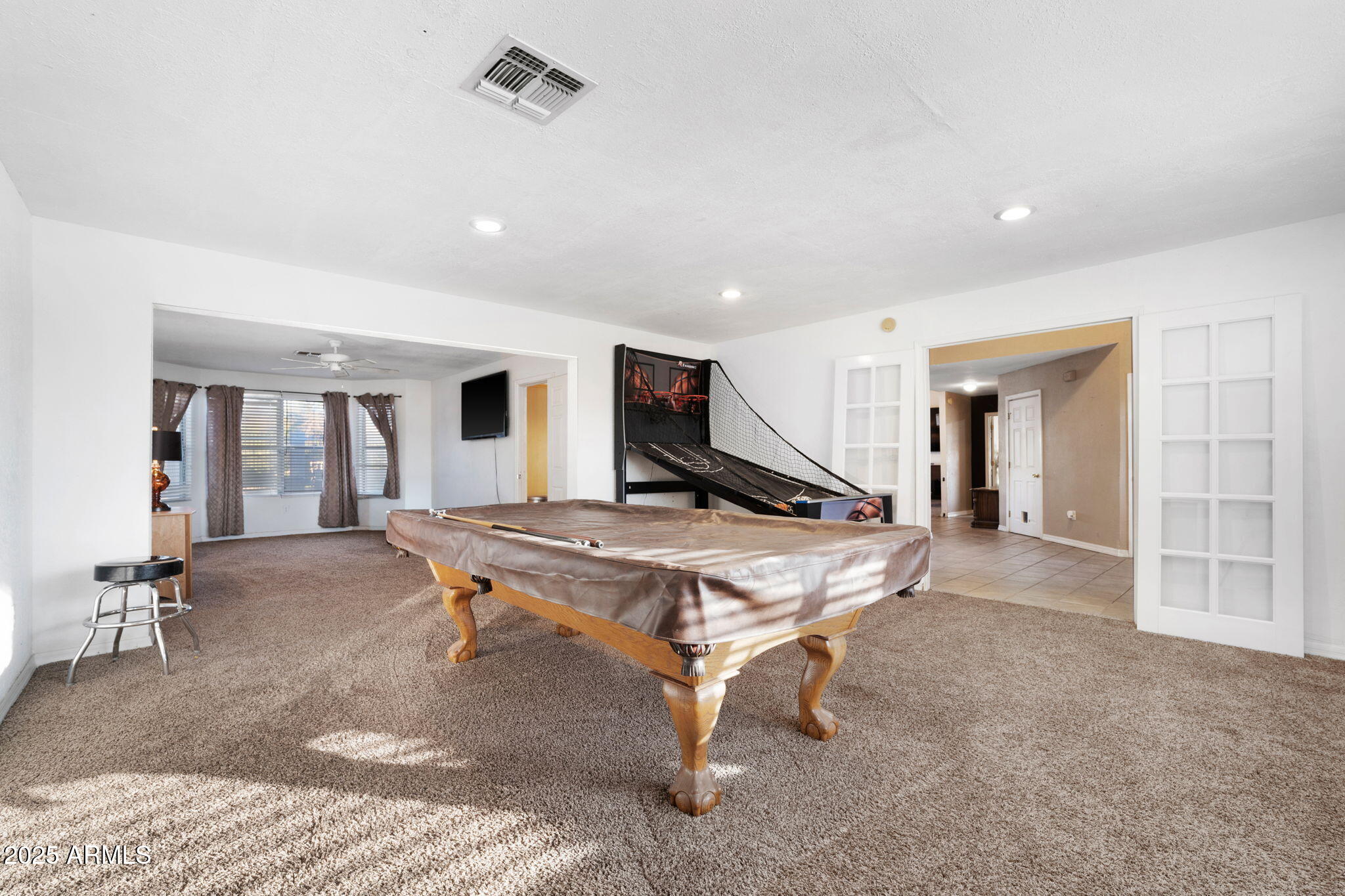 117 North Arroya Road Apache Junction, AZ 85119 - Photo 10 of 27 a room with table tennis air hockey table and arcade game machine