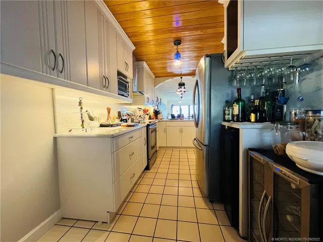 a view of a dining room with furniture and a window