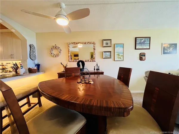 a living room with furniture and a lamp