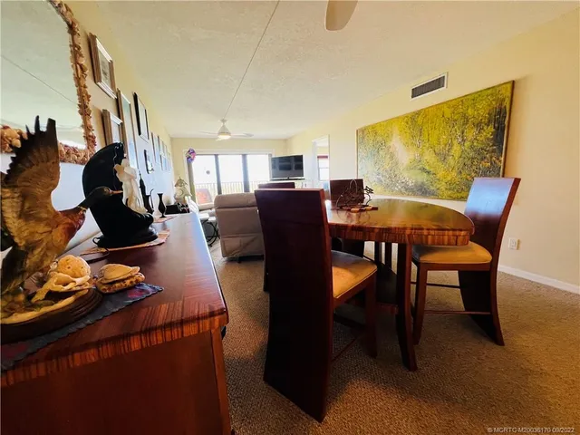a view of a balcony with furniture