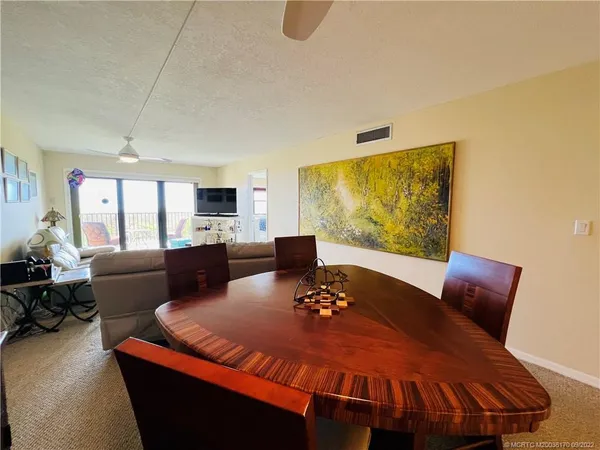 a view of a green yard next to a yard