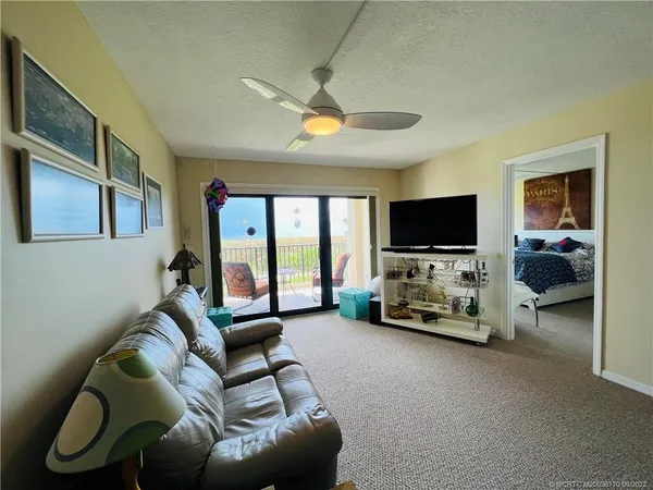a view of a chair and table in the balcony