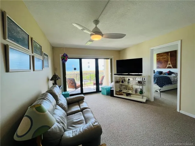 a view of a chair and table in the balcony