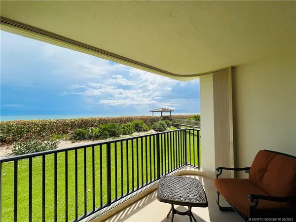 a bathroom with a double vanity sink mirror and tub