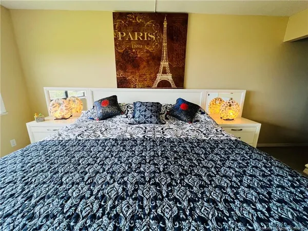a bathroom with a sink mirror vanity and toilet