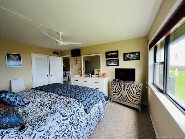 a bathroom with a toilet sink and shower