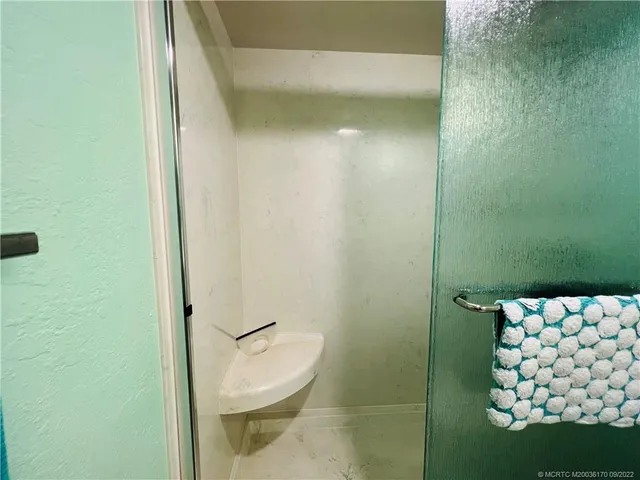 a view of a balcony with chairs