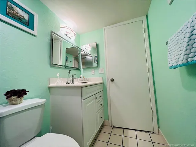 a view of small pool with seating area