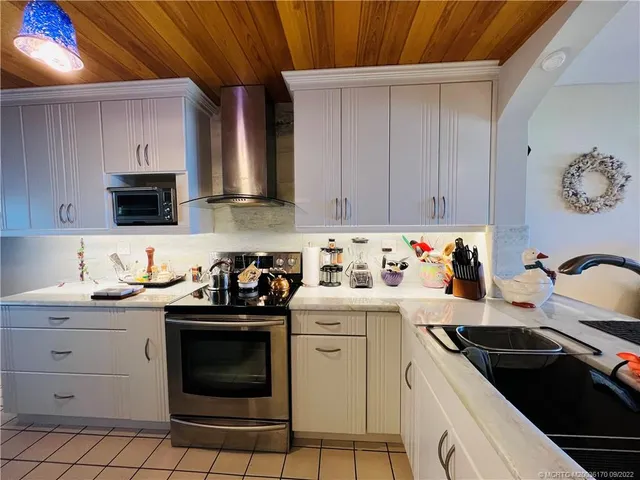 a living room with lots of furniture and a window