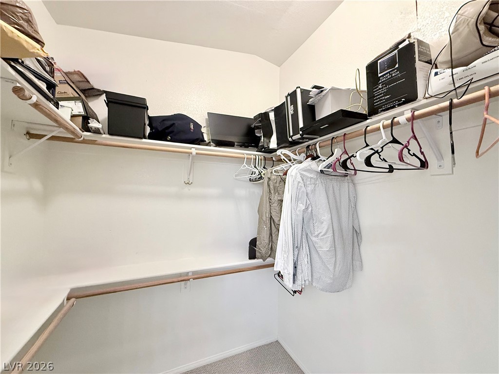1220 East Gamebird Road Pahrump, NV 89048 - Photo 16 of 49 Ample shelving and hanging space offer organized storage in this well-appointed closet.