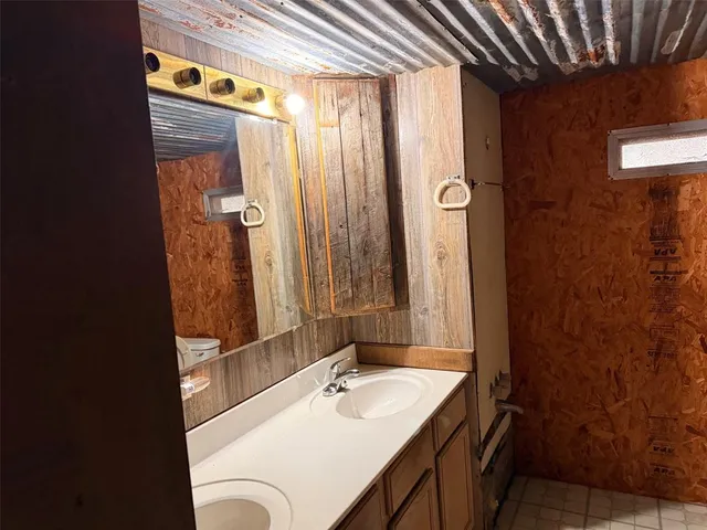 a bathroom with a tub and shower