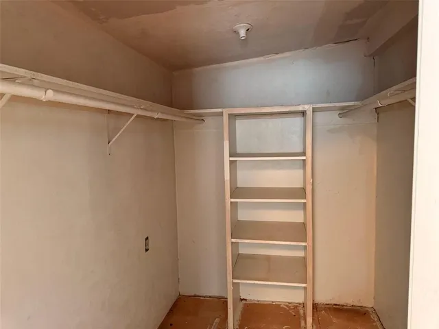 a view of a door with wooden fence