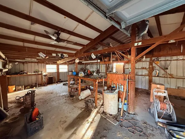 a view of house with backyard and furniture