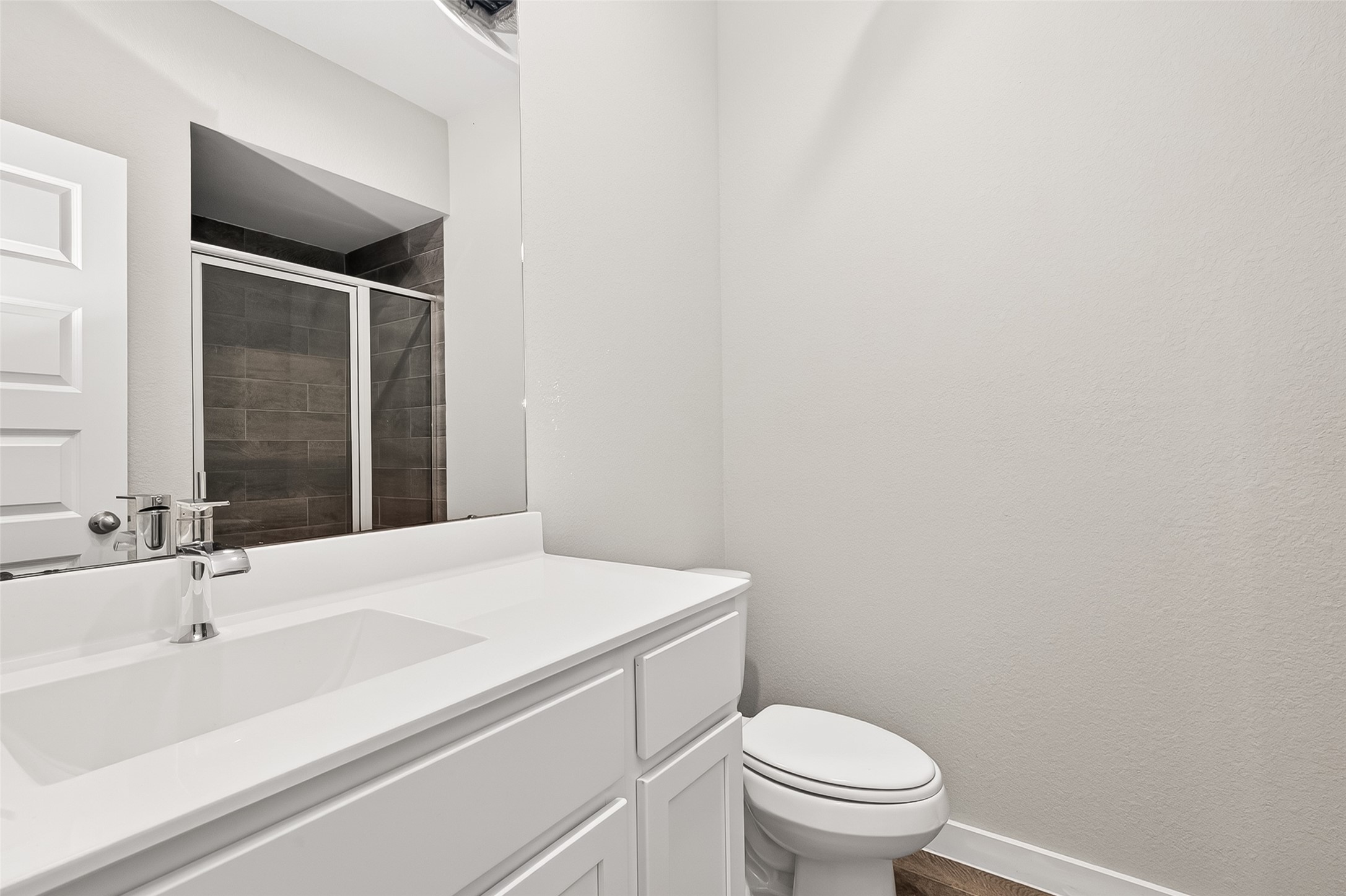 2142 Reed Cave Lane Spring, TX 77386 - Photo 8 of 50 a bathroom with a sink a toilet and a mirror