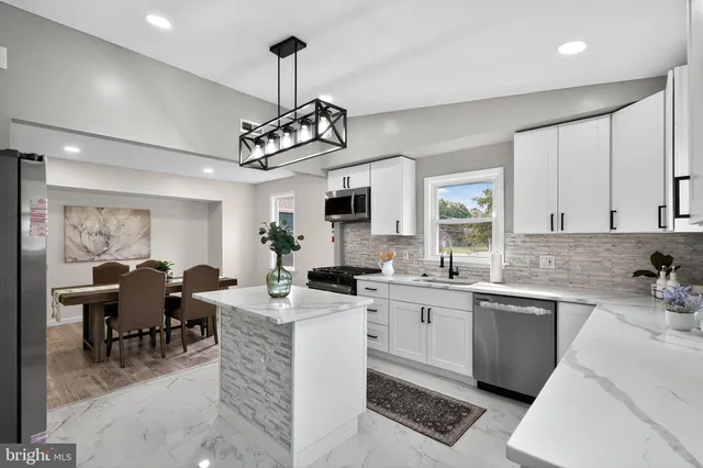 a view of a center island and living room