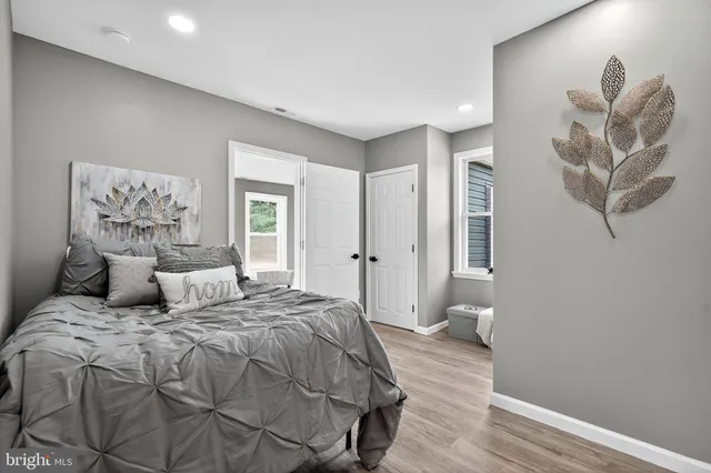 a bedroom with a large bed and a window