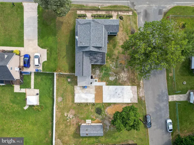 an aerial view of a house with a garden