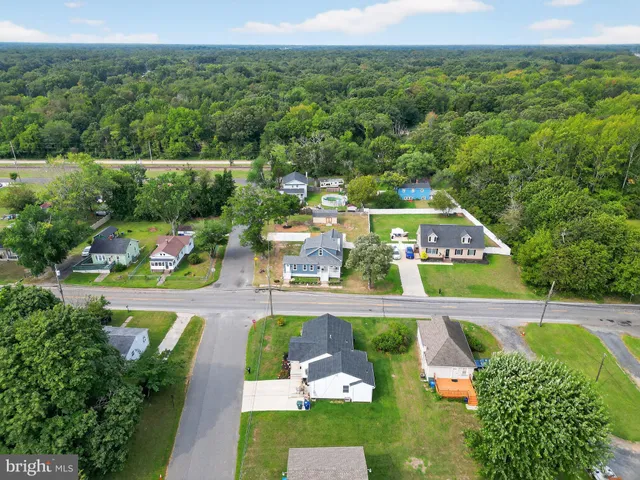 an aerial view of a house with a garden