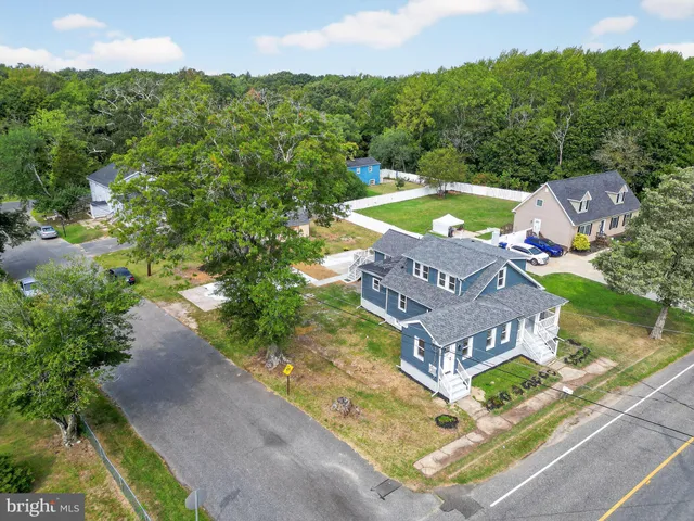 an aerial view of a house with a garden