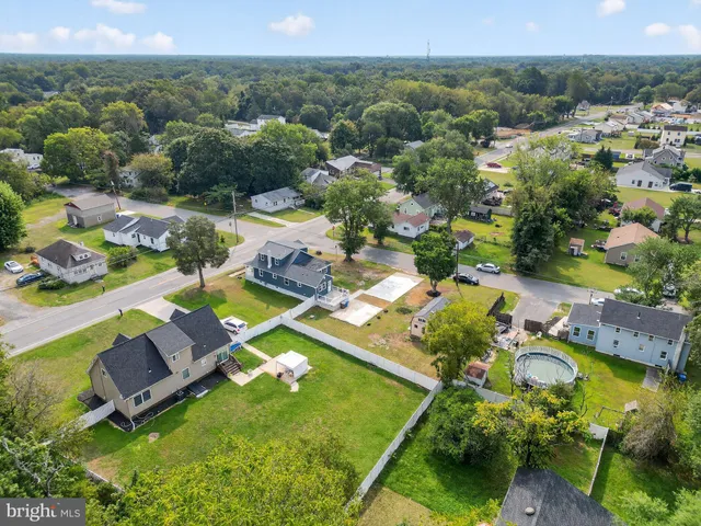 an aerial view of a house with a garden