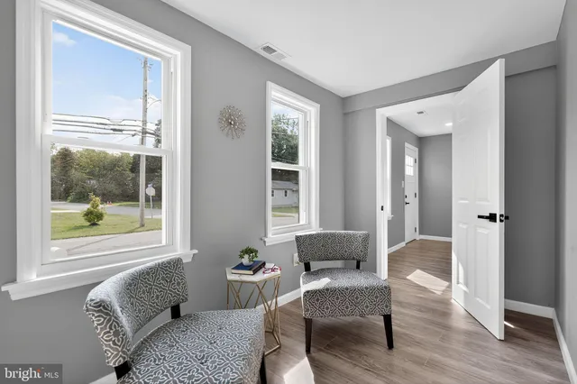 a living room with furniture and windows
