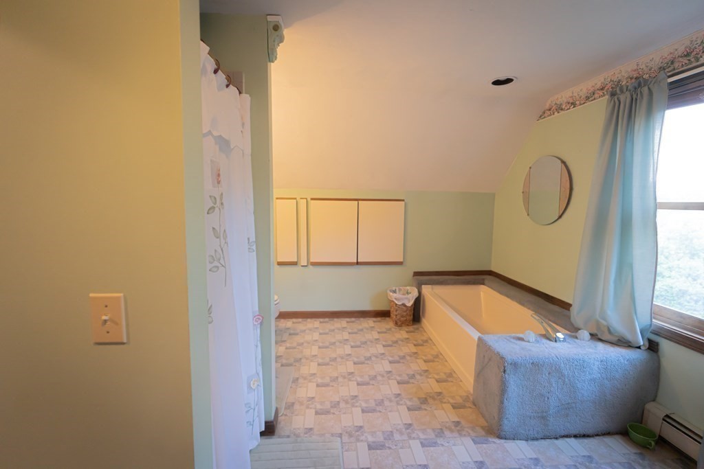 250 Rice Street Athol, MA 01331 - Photo 11 of 24 a bathroom with a tub sink and mirror