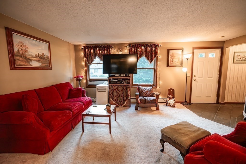 250 Rice Street Athol, MA 01331 - Photo 6 of 24 a living room with furniture and a flat screen tv