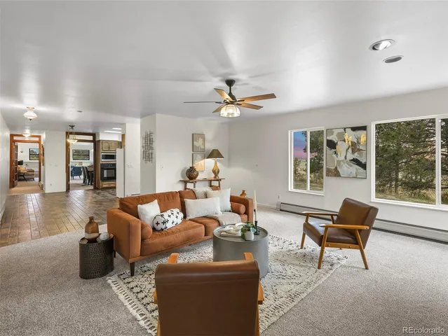 a kitchen with stainless steel appliances granite countertop a refrigerator sink and stove