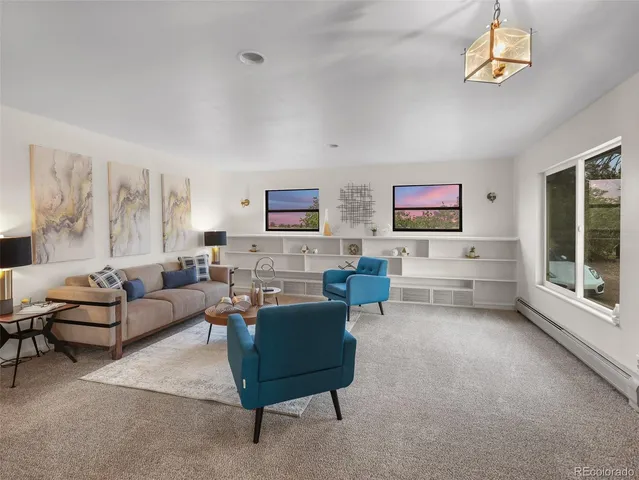 a spacious bedroom with a bed and a window